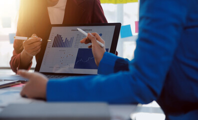 Meeting of business executives discussing analysis of the company's financial situation and business planning with partner collaboration and consultation of strategy.