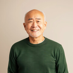 Obraz premium Portrait of a content Asian senior man with a warm smile and grey hair