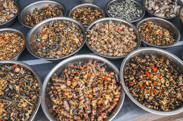 Fresh edible snails at a local market in Nha Trang, Vietnam.