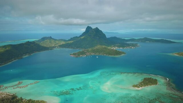 Stunning beauty of Bora Bora island helicopter. Tropical island panorama, coral reef atoll with turquoise lagoon and mount otemanu dominating ocean landscape. Remote wild nature paradise. Aerial shot