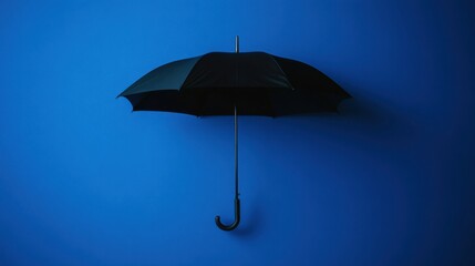 Black Umbrella Floating Against Blue Background