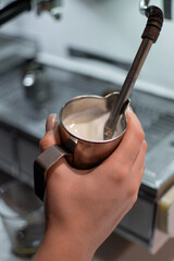 barista whips milk 