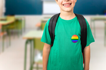 Boy in green t-shirt with rainbow symbol