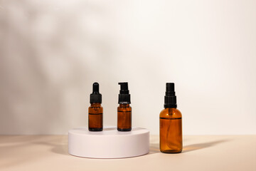 Amber cosmetic bottle with pipette on white podium, product packaging, anti aging serum with peptides, cosmetics mockup,