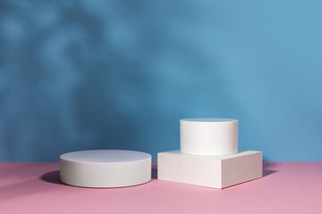 Blue background for product presentation with shadows and light. Empty podiums. Mockup