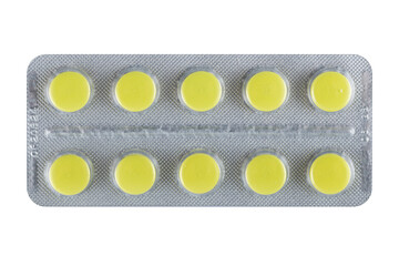 yellow pills tablets in blister pack isolated on white background