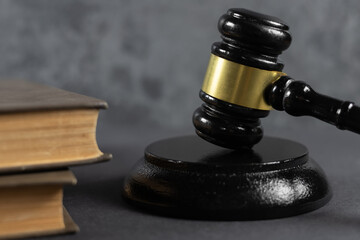 Lawyer or judge's hammer in court The auction hammer is on the woo table.