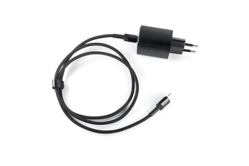 Charger with black plug on white background, charger with block, for smartphone