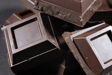 broken chocolate bar chips, parts or pieces pile