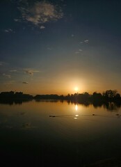 beautiful sunset over the lake, golden nature reserve, sunset view from the shore