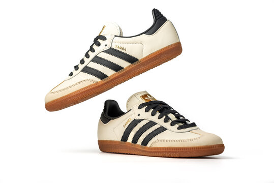Belgrade, Serbia - August 30, 2024. Adidas Originals Samba Beige with black stripes. Trainers Shoes, vintage sneaker trainers. Isolated on white background with clipping path included