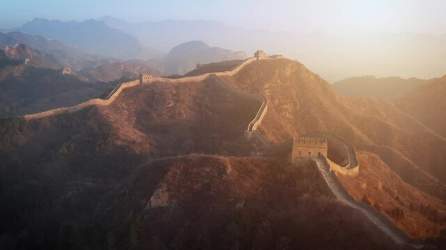 Aerial shot of the Great Wall of China at sunrise.