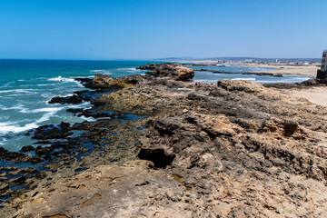 Dynamic Ocean Waves Colliding with Essaouiras Rugged Coastline.