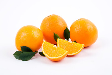 Fresh oranges with leaves on a white background