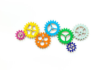 Colorful gears are connected together as a symbol of teamwork and business automation