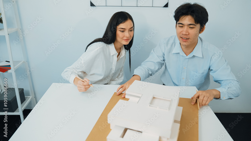 Aufkleber closeup of skilled architecture engineer team measure and decide house model while working together 