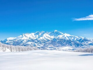 Snowcapped mountains with a crystalclear blue sky, stunning winter landscape