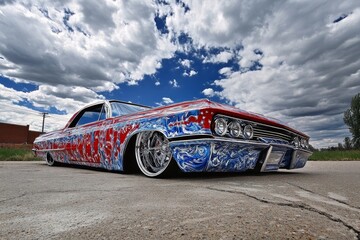 Custom lowrider with intricate paintwork hydraulic suspension.