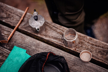 Disassembled Moka Pot on Wooden Table for Outdoor Coffee Preparation