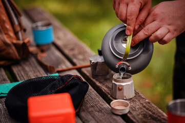 Filling Moka Pot with Water for Outdoor Coffee Brewing