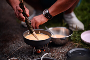 Camp Cooking with Improvised Wooden Spoon