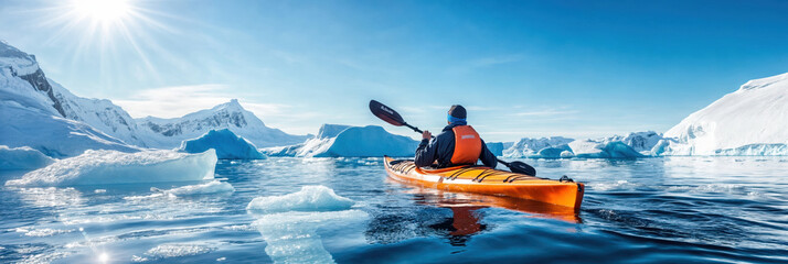Kayaker exploring glacial waters in antarctica