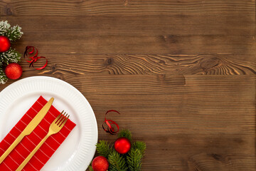 Festive Christmas table setting with red colored decoration. Top view