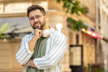 Sad unhappy young man tourist thinks over life concerns, suffers from unfair situation. Problem,...