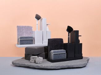 Black and white sink organisers sitting on top of a flat rock