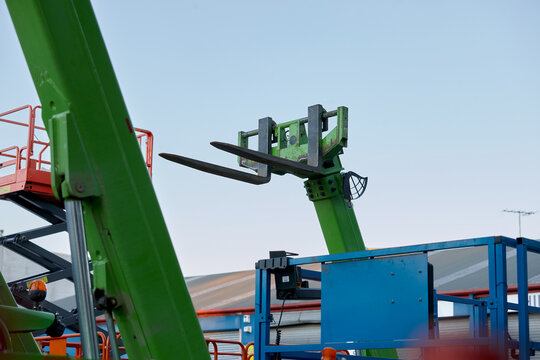 closeup of green cargo fork lifter