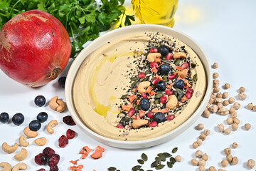 Variety of fruits, nuts, and honey syrup on a table