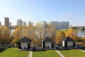 Autumn landscape with a recreation area and houses in the Russian city of Novosibirsk