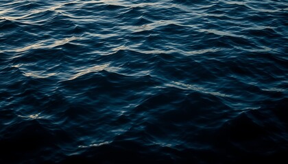 Obraz premium Dark Blue Water Waves with Subtle Light Reflection