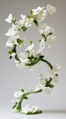 Fototapeta premium White Porcelain Flower Sculpture with Green Stems and Leaves