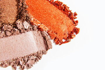 Composition of eyeshadow smears on a light white background. Cosmetic texture, vibrant and layered.