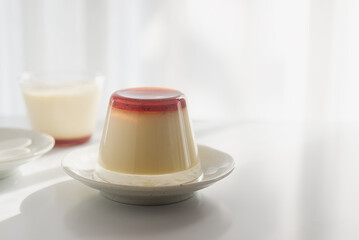 Homemade caramel custard pudding in an upside down glass on a plate, how to unmold caramel pudding.