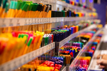 rows and rows of pens and markers in a shop