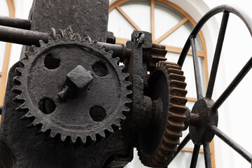 Massive old black gears, close-up photo with selective focus
