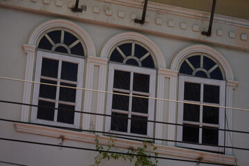 Detailed view of windows, doors and balconies of city buildings 