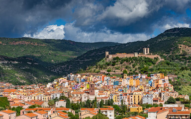 Storm clouds over the picturesque, historic town center of Bosa. Oristano, Sardinia, Italy