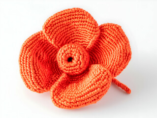 Fototapeta premium A vibrant orange crocheted flower with intricate detailing and a central spiral.