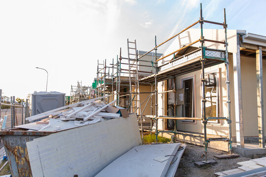 town houses being built near Brisbane with a skip full of waste