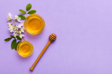 honey jar with acacia flowers and leaves. fresh honey top view flat lay