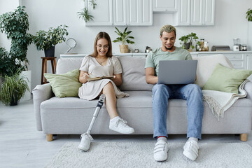 Friends relax together, sharing laughs and digital moments in a cozy living space.