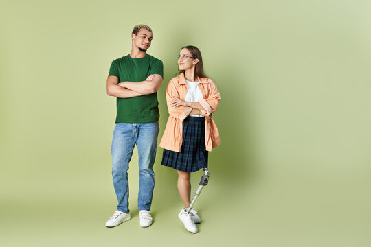 non binary person enjoys time with their friend who has a prosthetic leg.