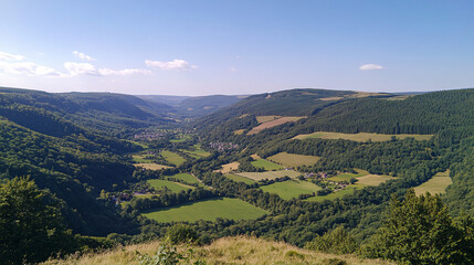 Fototapeta premium green valley landscape under blue sky in belgium