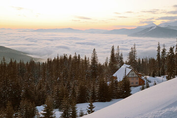 sunrise on the mountain top. Above the clouds. Morning in the forest. Village in the mountains