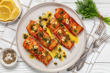 salmon piccata with lemon caper sauce on plate