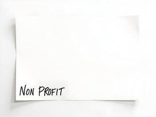 Blank paper with handwritten Non Profit message at a desk, ideal for organizational brainstorming or planning strategies