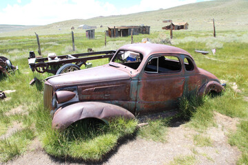 Rustic Abandoned Vintage Car in Rural Countryside Field